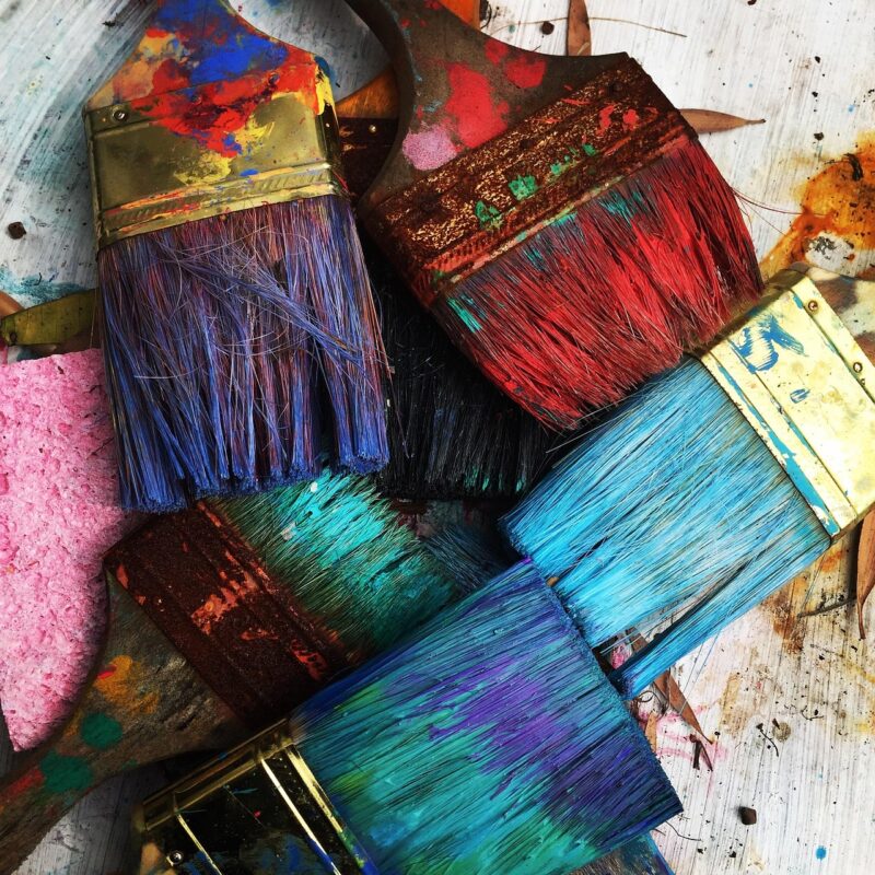 Paint brushes and palette in a studio