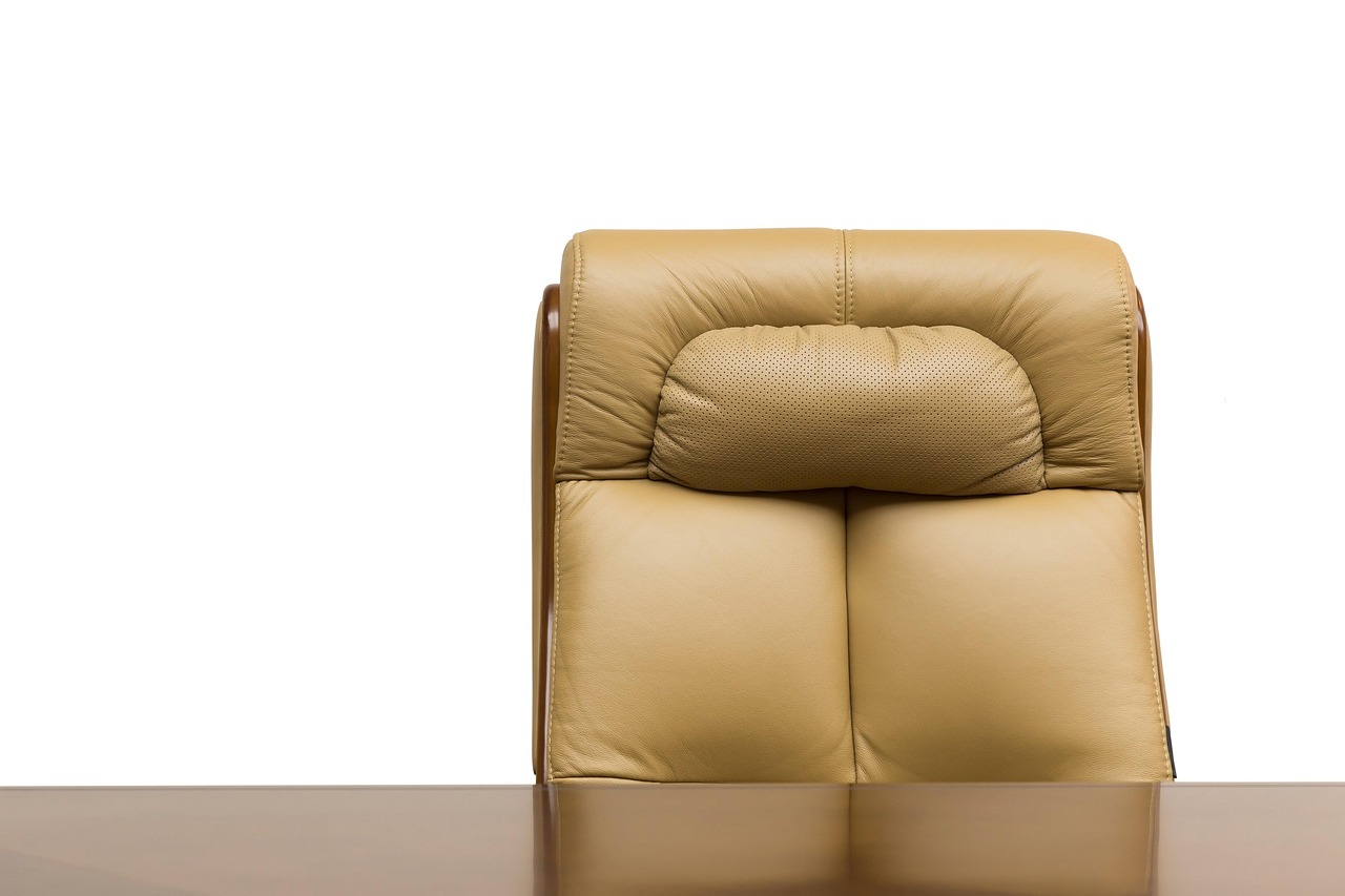 Ergonomic office chair at a meeting table in a bright workplace