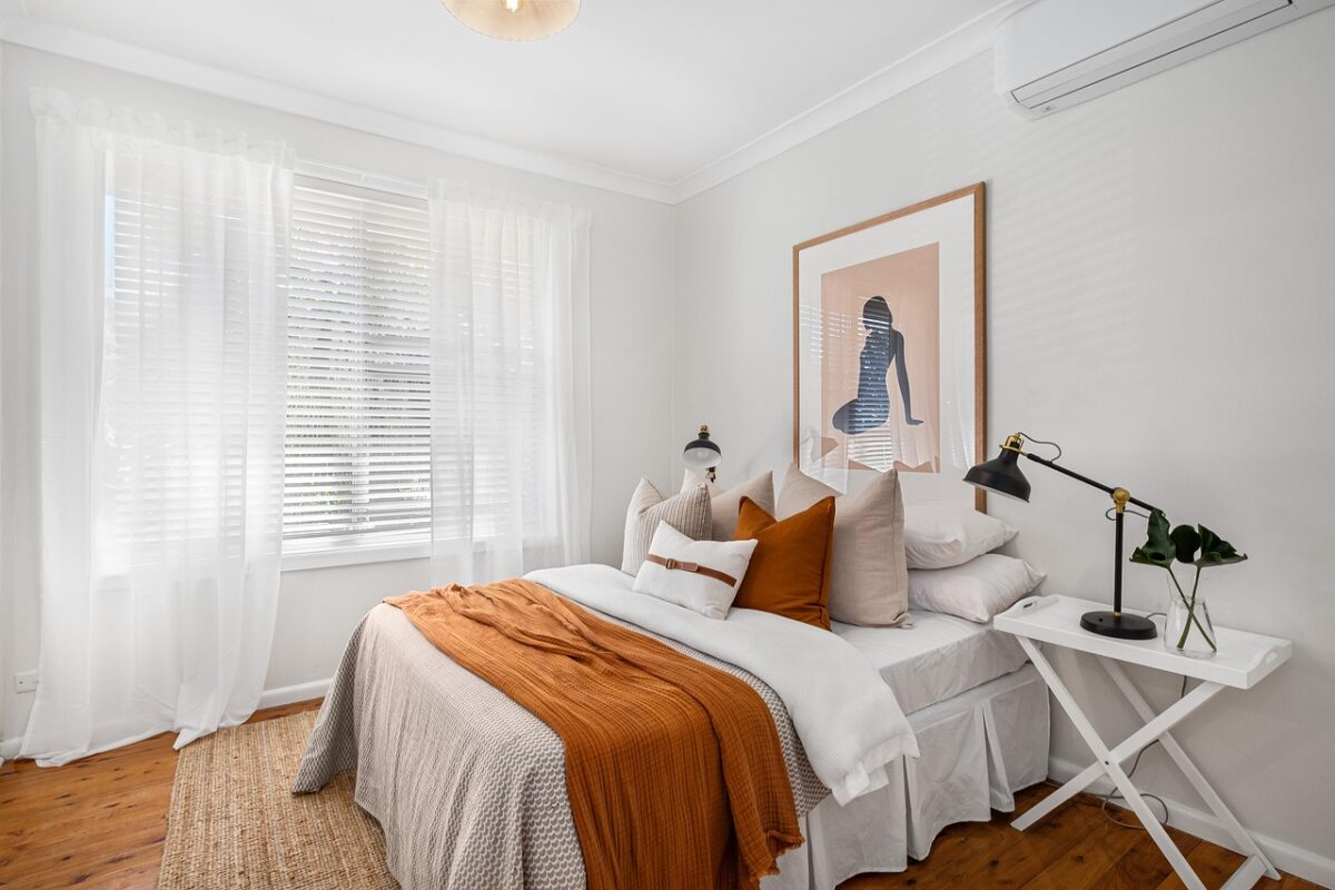 Small apartment living area with a reed diffuser on a side table