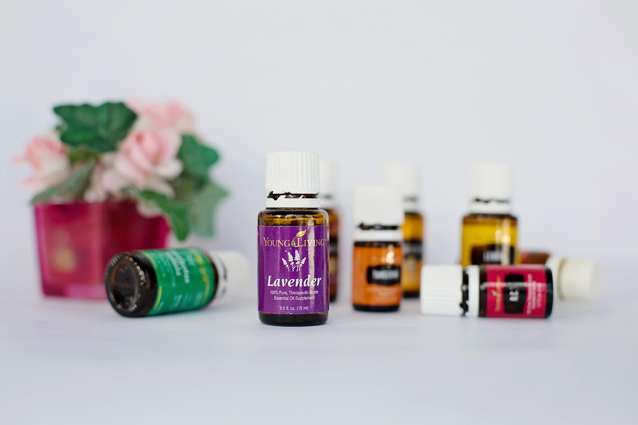 Ultrasonic essential oil diffuser releasing mist in a living room