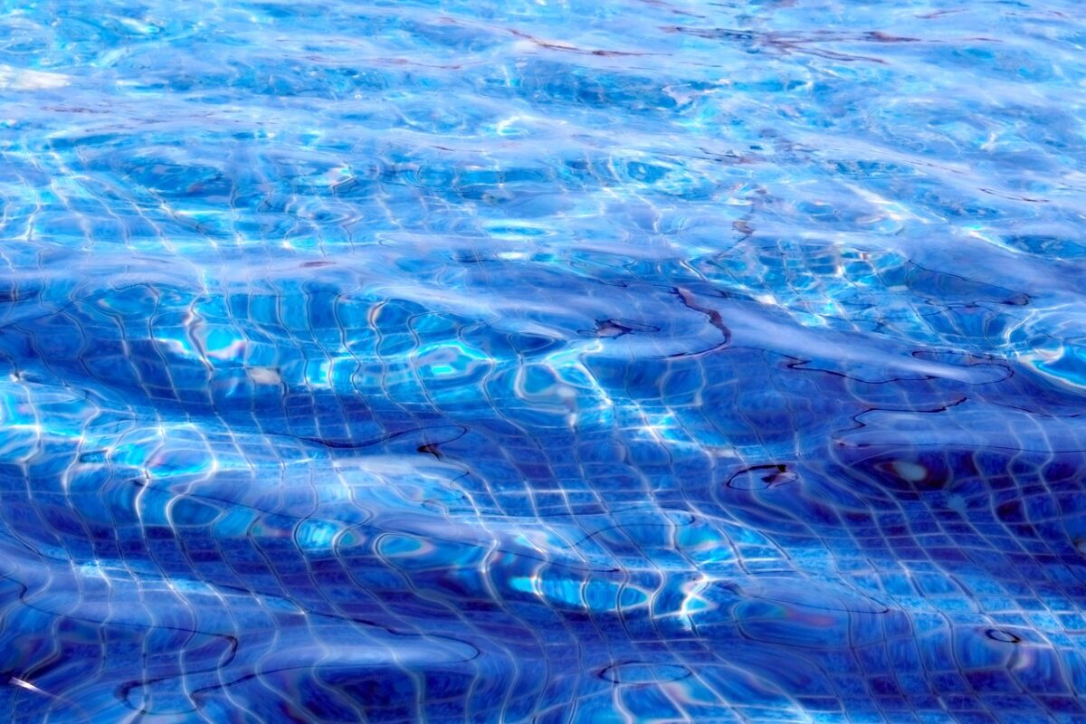 Sunlit swimming pool surface