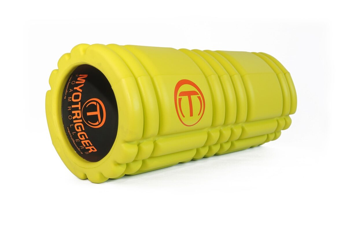 Foam roller and percussion device on a gym floor