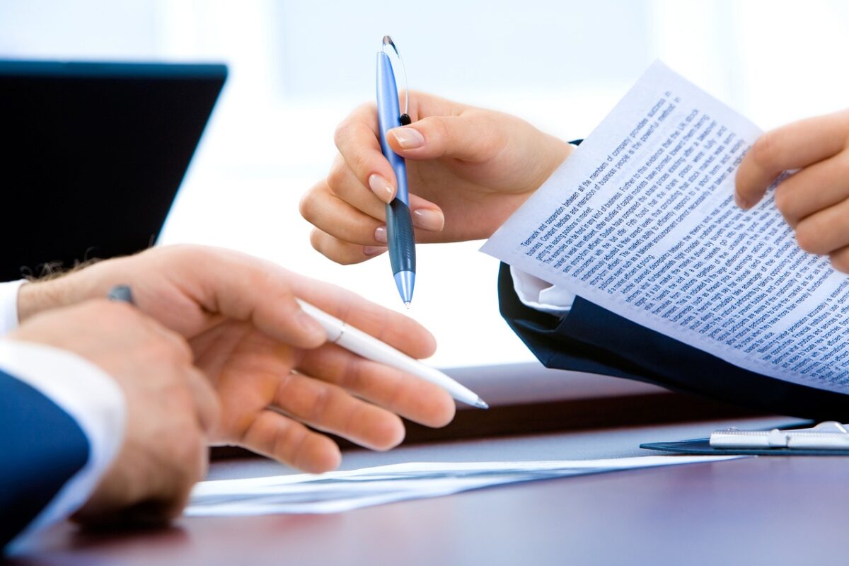 Paperwork and a card on a desk