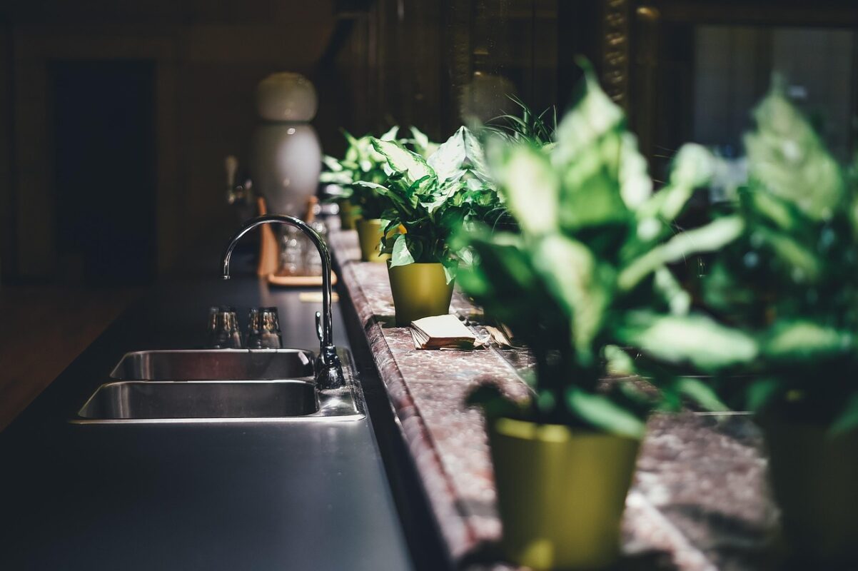 Black waterfall kitchen sink installed in a worktop