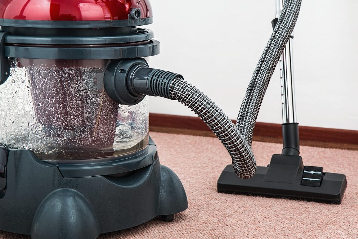 Cleaning the gaps: under appliances, behind radiators, on top of cabinets