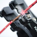 Spring-loaded wire stripper and cutter