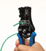 Spring-loaded wire stripper and cutter
