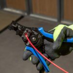 Spring-loaded wire stripper and cutter