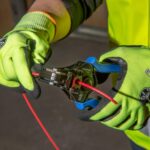 Spring-loaded wire stripper and cutter
