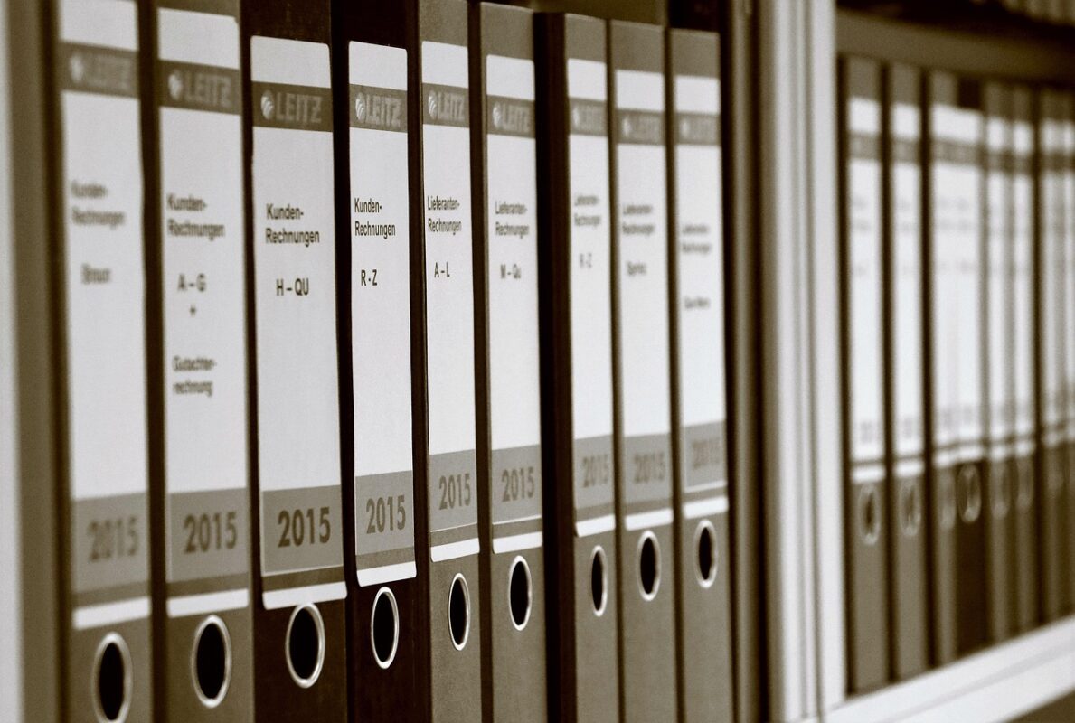 Hanging file folders in an open filing drawer